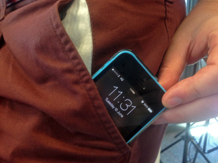 An iPhone 5C smartphone in a pocket