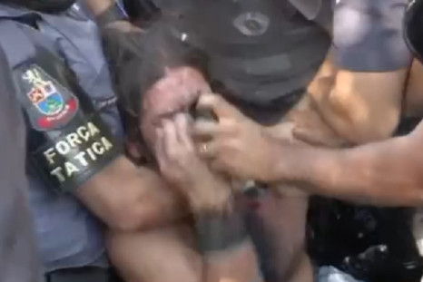Protester is blasted with pepper spray at close range by police in Sao Paolo