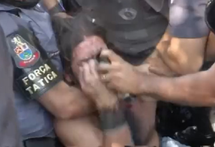 Protester is blasted with pepper spray at close range by police in Sao Paolo