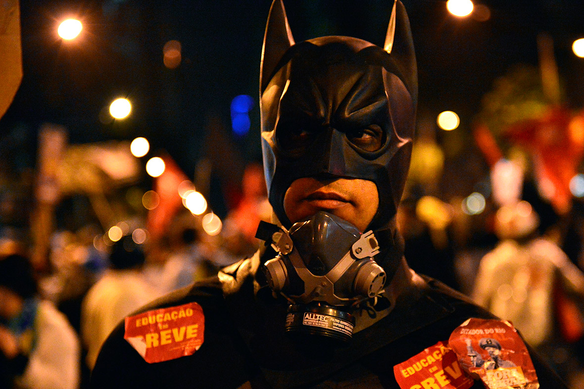 Batman marches during a teachers protest demanding better working conditions, on October 7, 2013