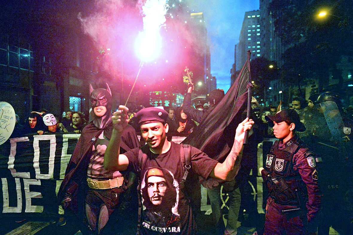 The Superhero joins forces with Latin American hero Ernesto Che Guevara during a Guy Fawkes Day protest in Rio on November 5, 2013