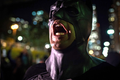 Batman shouts during a protest by anarchist group Black Bloc against the World Cup on May 30, 2014
