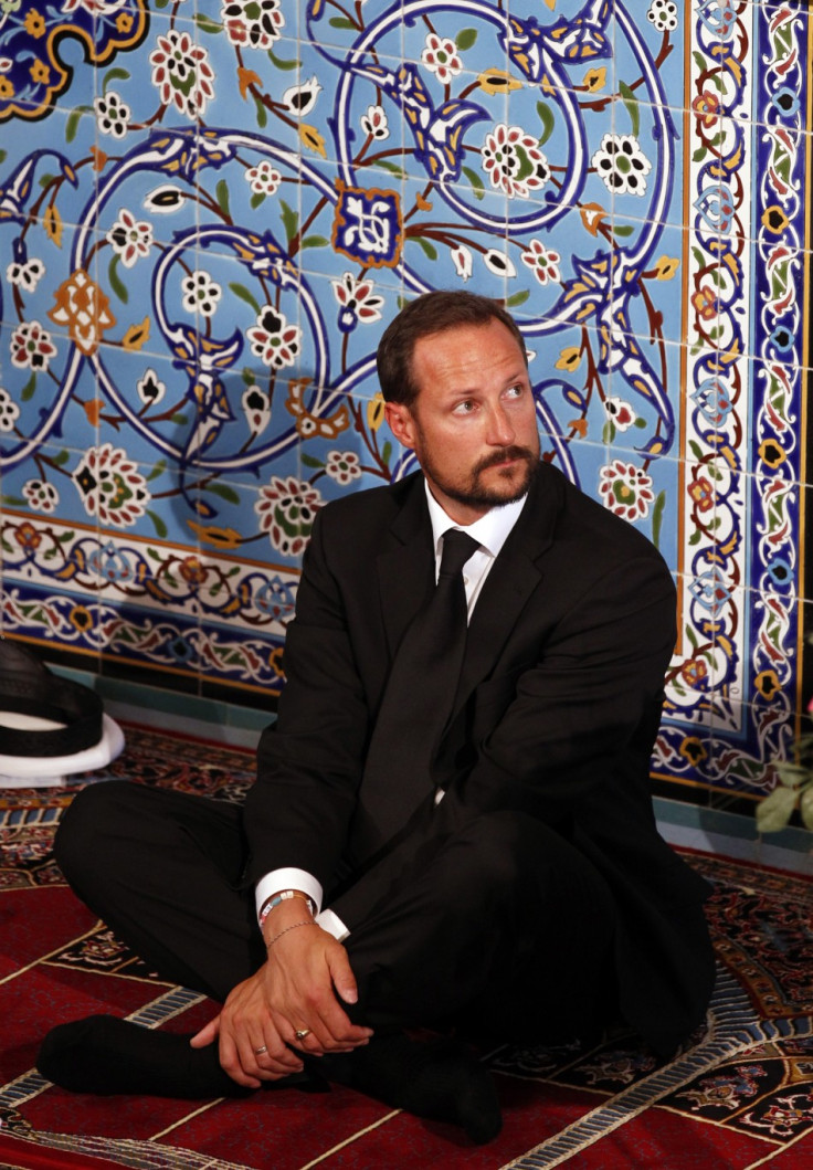 Norway's Crown Prince Haakon sits inside the World Islamic Mission Mosque in Oslo