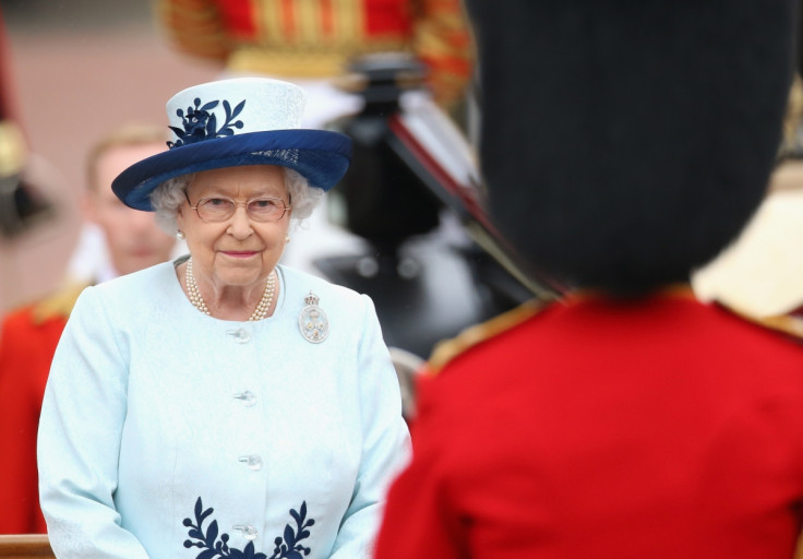 The Queen takes a salute during the Trooping of the Colour (Getty)