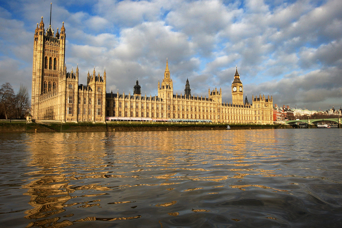 the Houses of Parliament on the banks of the River Thames