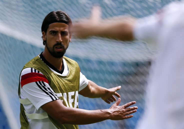 Germany's Sami Khedira stretches during a training session at the Arena Fonte Nova stadium ahead of their 2014 World Cup against Portugal in Salvador, June 15, 2014