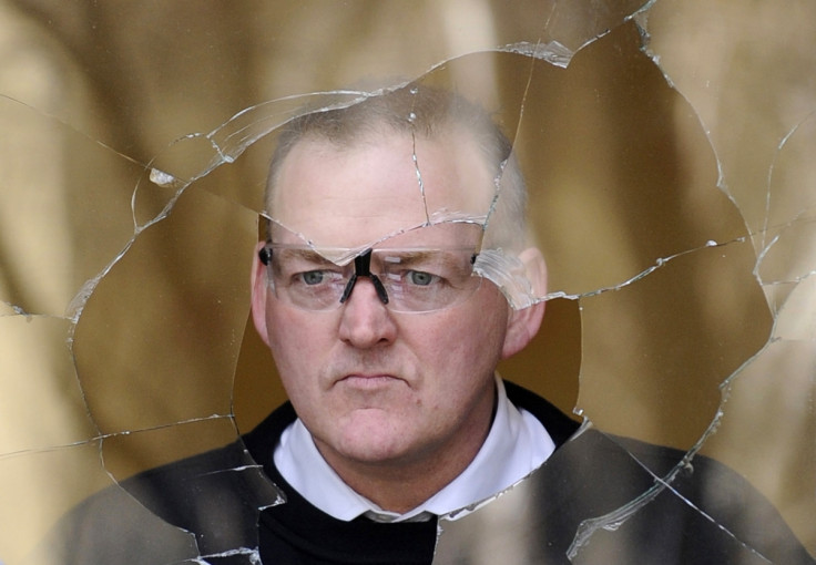 worker replaces a pane of glass in the vandalised home of former Royal Bank of Scotland chief Fred Goodwin in Edinburgh, Scotland,