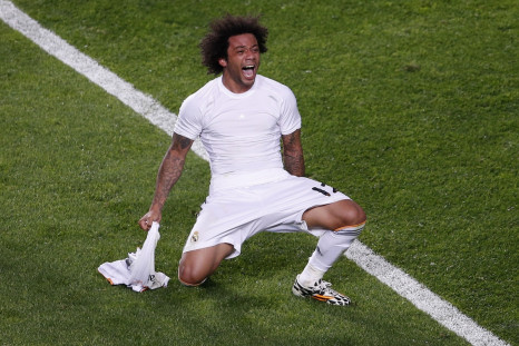 Real Madrid's Marcelo celebrates after scoring a goal against Atletico Madrid during their Champions League final soccer match at the Luz Stadium in Lisbon May 24, 2014