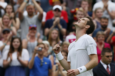 Andy Murray of Britain reacts after defeating David Goffin of Belgium in their men's singles tennis match at the Wimbledon Tennis Championships, in London June 23, 2014