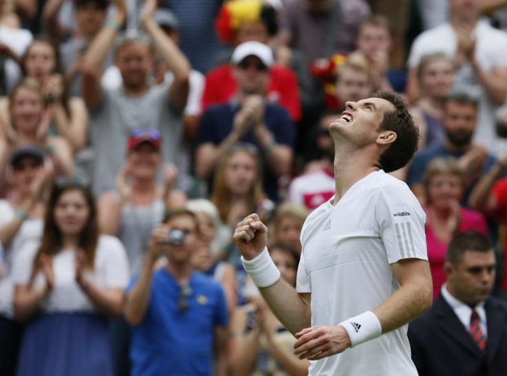 Andy Murray of Britain reacts after defeating David Goffin of Belgium in their men's singles tennis match at the Wimbledon Tennis Championships, in London June 23, 2014