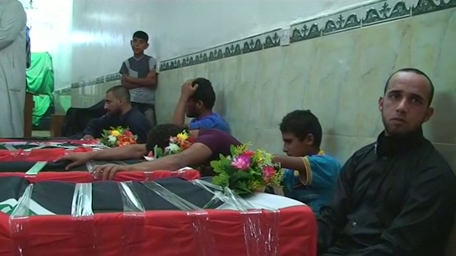 Shi'ites Mourn Relatives Killed In Market Attack South Of Baghdad ...