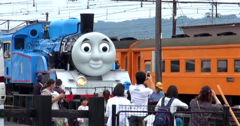 Thomas the Tank Engine, with faithful carriages Annie and Clarabel in the background