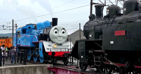 Thomas the Tank Engine tows another steam train during a test watched by the public