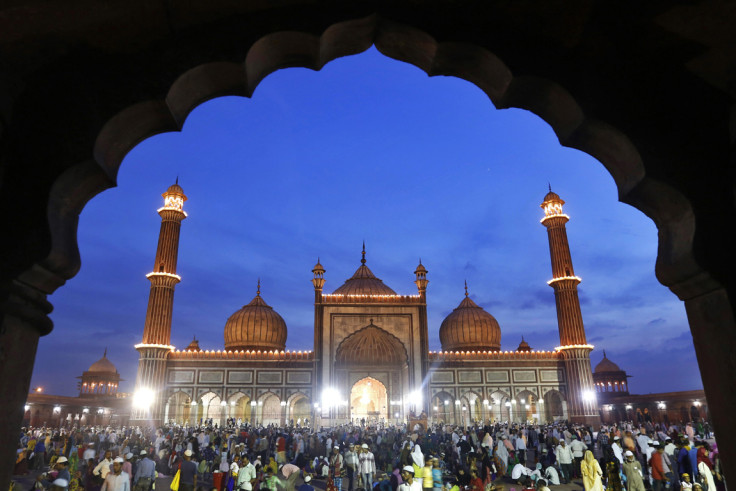 Muslims gather after having their iftar (breaking fast) meal at the Jama Masjid (Grand Mosque) in the old quarters of Delhi