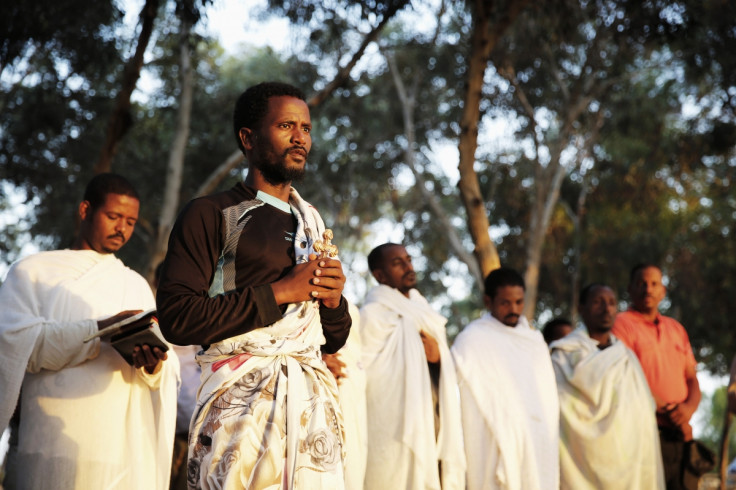 African asylum seekers pray at sunrise after leaving Holot open detention centre and camping out over night in southern Israel's Negev desert,