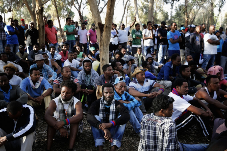 African asylum seekers gather for a morning meeting during an overnight protest after leaving Holot open detention centre in southern Israel's Negev desert