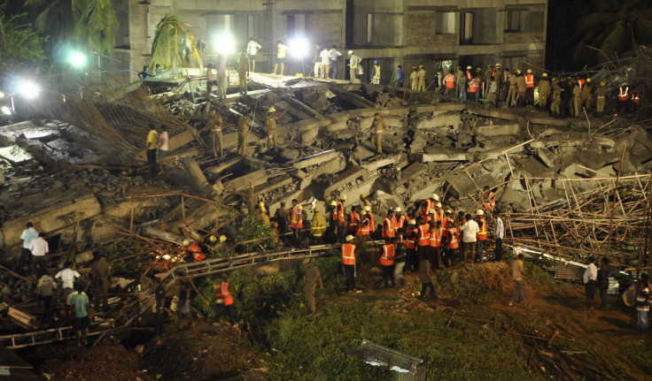 Rescue workers conduct a search operation for survivors at the site of a collapsed 11-storey building that was under construction on the outskirts of the southern Indian city of Chennai June 28, 2014.