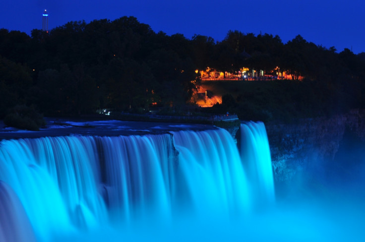 3. Blue light illuminates the falls in Niagara Falls