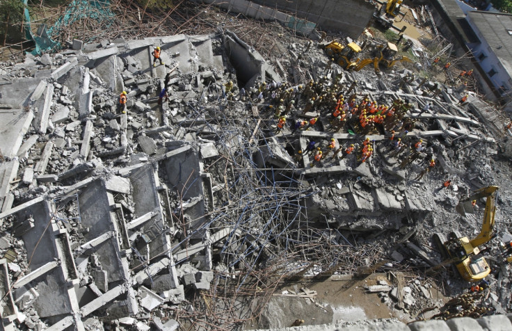 Rescue workers conduct a search operation for survivors at the site of a collapsed 11-storey building that was under construction on the outskirts of the southern Indian city of Chennai.