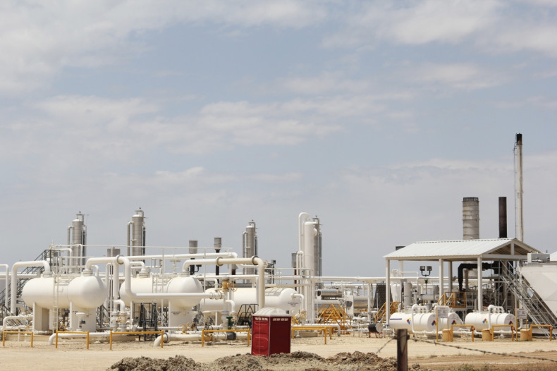 An oil and gas processing plant fed by local shale wells is pictured along a highway outside Carrizo Springs, Texas