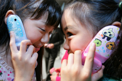 Children talking on their cell phones