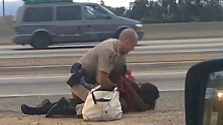 LA Police officer punches woman