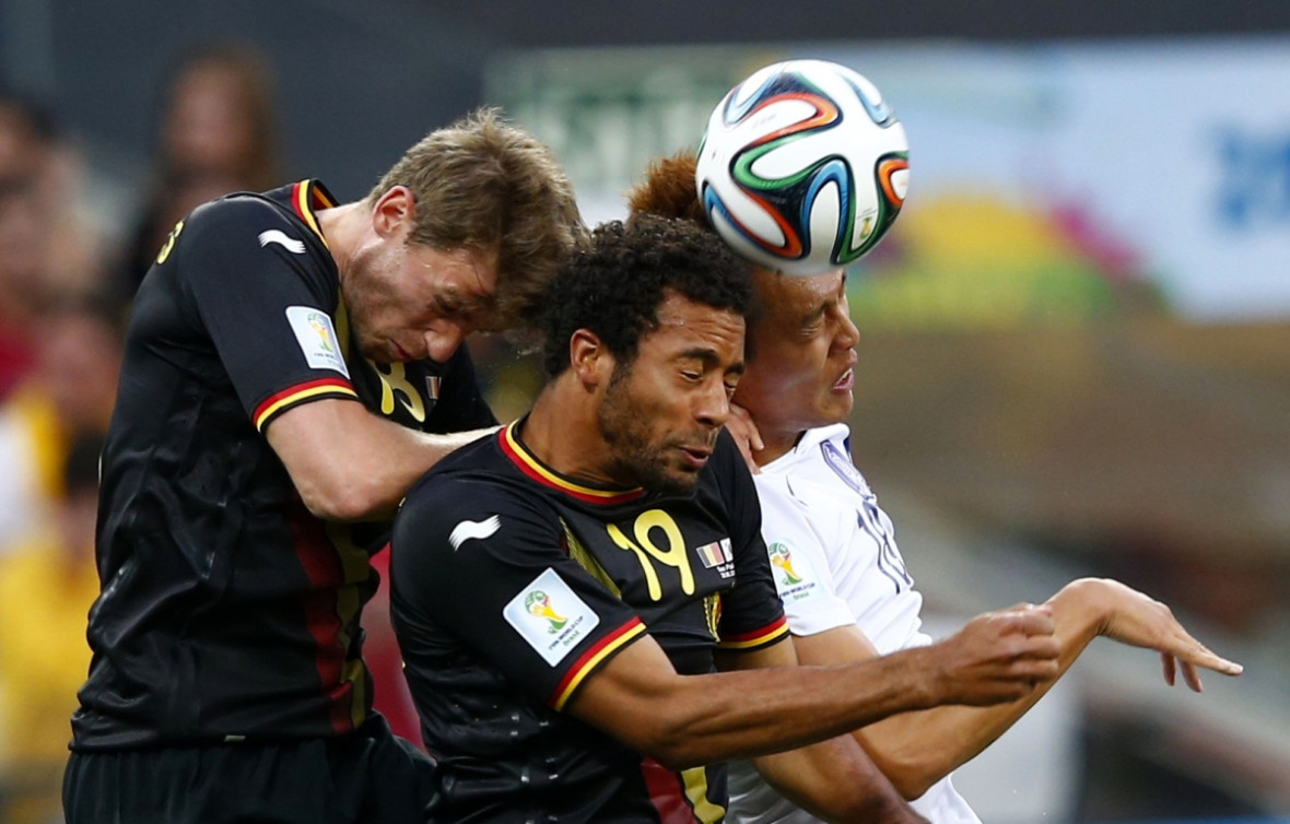 Doing the hand jive: South Korea's Kim Shin-wook (R) fights for the ball with Belgium's Nicolas Lombaerts (L) and teammate Moussa Dembele during their 2014 World Cup Group H soccer match at the Corinthians arena in Sao Paulo Doing the hand jive: South Korea's Kim Shin-wook (R) fights for the ball with Belgium's Nicolas Lombaerts (L) and teammate Moussa Dembele during their 2014 World Cup Group H soccer match at the Corinthians arena in Sao Paulo