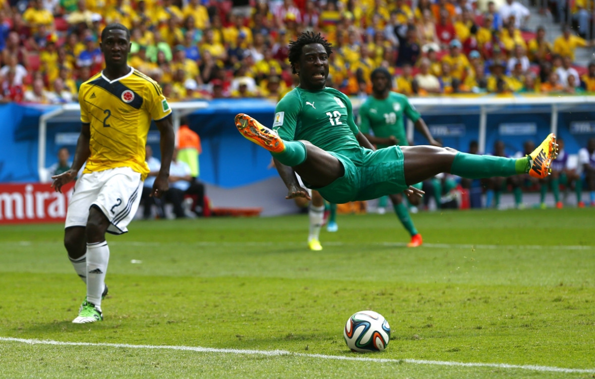 This pose isn't at all painful. Colombia's Cristian Zapata watches on in disbelief as Ivory Coast's Wilfried Bony jump during their 2014 World Cup Group C soccer match This pose isn't at all painful. Colombia's Cristian Zapata watches on in disbelief as Ivory Coast's Wilfried Bony jump during their 2014 World Cup Group C soccer match
