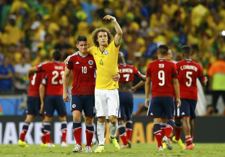 Brazil's David Luiz gestures at Colombia's James Rodriguez as he tells the spectators to applaud him after their 2014 World Cup quarter-finals at the Castelao arena in Fortaleza