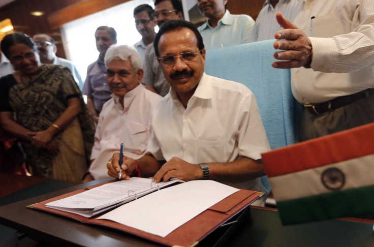 India's Railway Minister Sadananda Gowda (C) poses after giving the final touches to the railway budget for the 2014/15 fiscal year