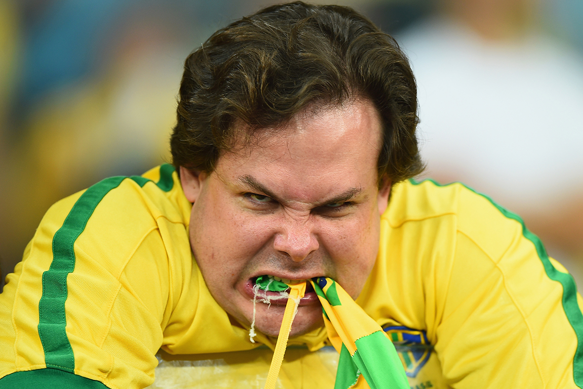 Hot Shots Photos of the Day: Brazil Fans, Al-Qaeda Notebook, Obama