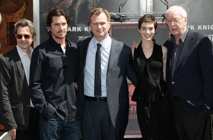Director Christopher Nolan (C) poses with actors (from L-R) Gary Oldman, Christian Bale, Anne Hathaway and Michael Caine