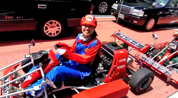 A real-life Mario driving his Mario Kart in Tokyo