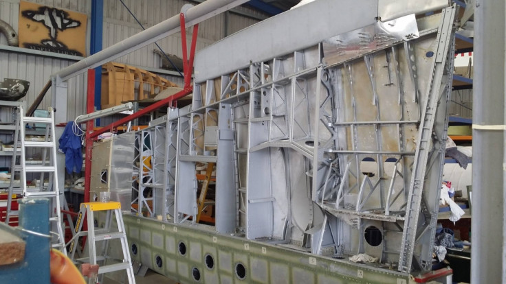 The wing-frame of a Spitfire XVI, TB252 plane being repaired at the workshop