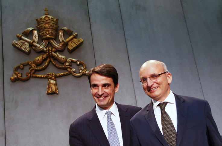 Jean-Baptise de Franssu (L), new president of Vatican Bank IOR, and outgoing President Ernst Von Freyberg pose during a news conference at the Vatican July 9, 2014