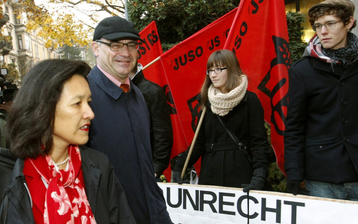 Members of the youth organisation of the Swiss Social Democratic Party welcome former Swiss private banker Rudolf Elmer. The word on the banner reads, "Injustice"