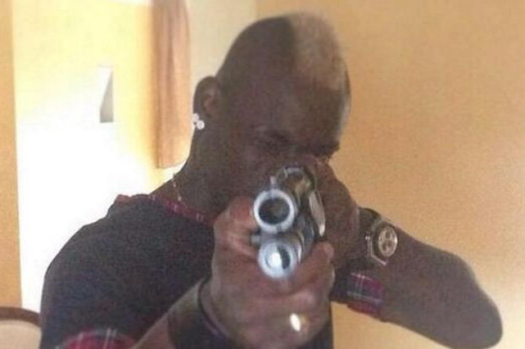 Mario Balotelli poses with shotgun in banned Instagram picture in which he took aim at 'haters'