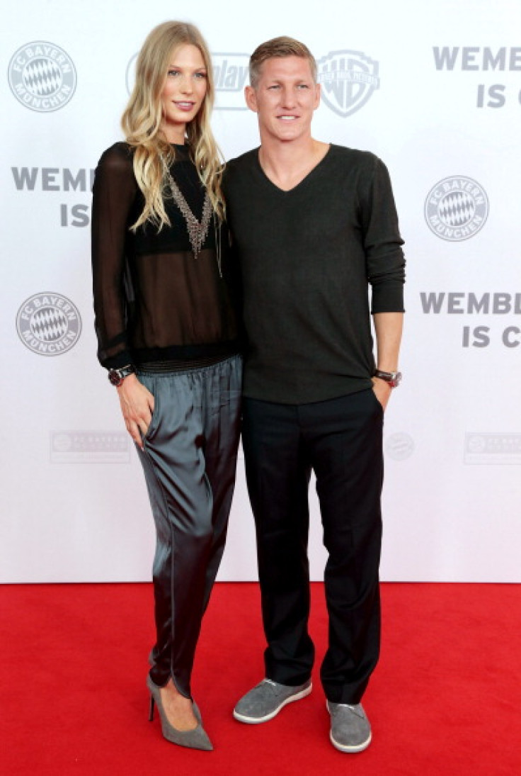 German football player Bastian Schweinsteiger (R) and his girlfriend Sarah Brandner
