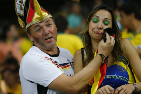 Who says chivalry is dead? A Germany fan consoles a Brazil supporter