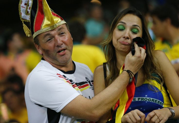 Who says chivalry is dead? A Germany fan consoles a Brazil supporter