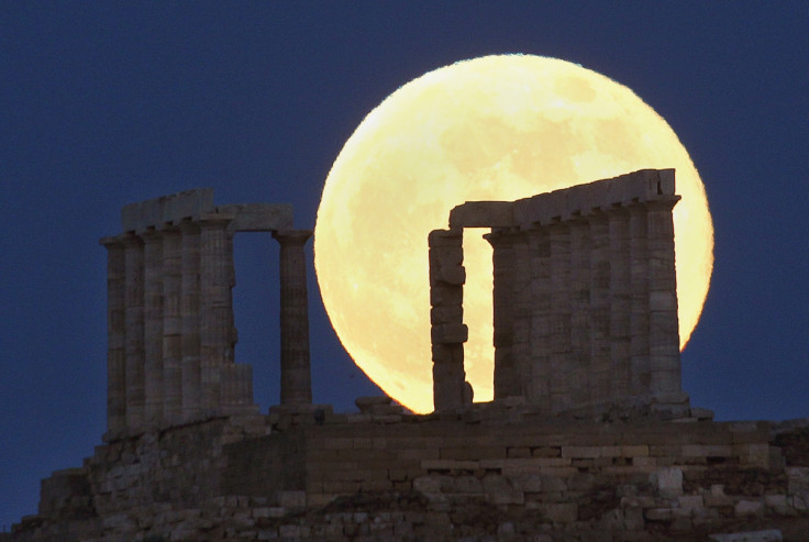 A supermoon rises over the temple of Poseidon, the ancient Greek god of the seas, in Cape Sounion, Greece