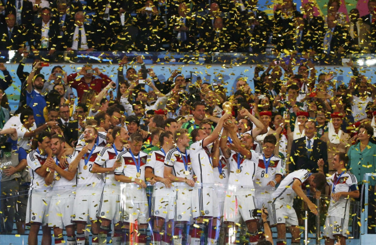 Germany's players lift the World Cup trophy as they celebrate their 2014 World Cup final win against Argentina at the Maracana stadium in Rio de Janeiro July 13, 2014.