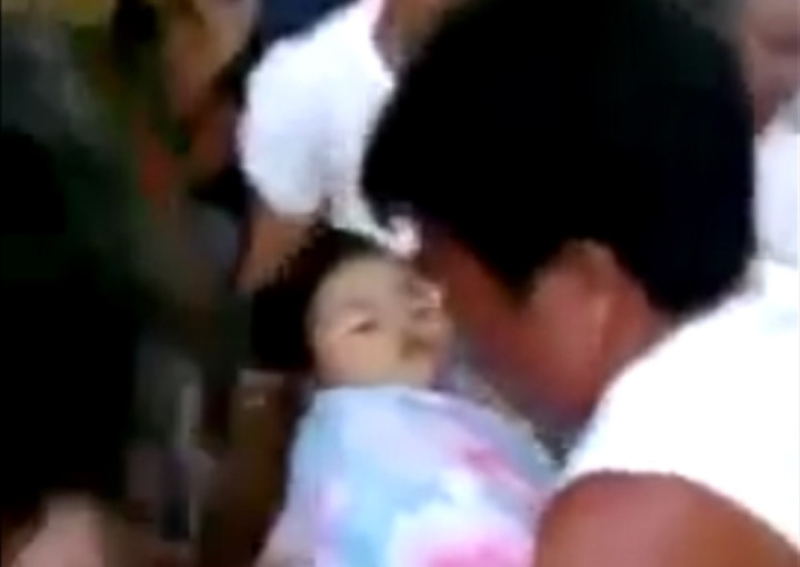 Baby provided a shock to mourners by waking up at her own funeral in the Philipinnes Baby provided a shock to mourners by waking up at her own funeral in the Philipinnes