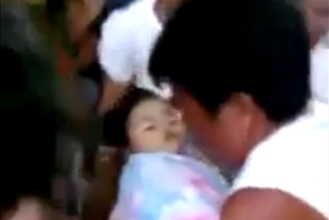 Baby provided a shock to mourners by waking up at her own funeral in the Philipinnes