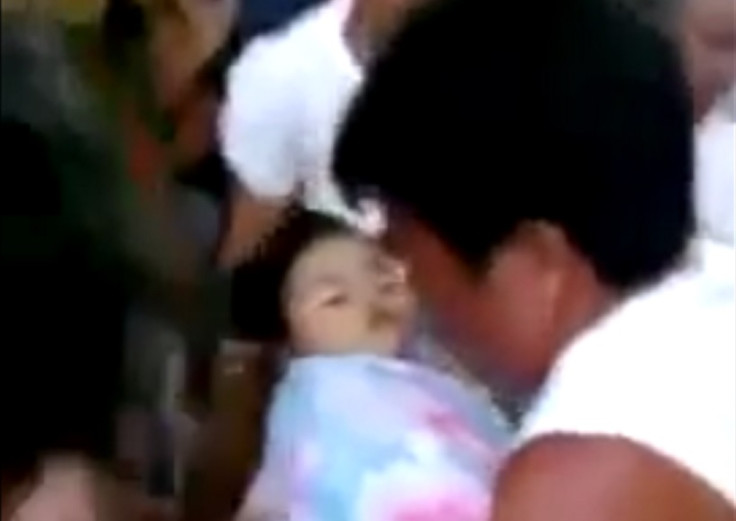 Baby provided a shock to mourners by waking up at her own funeral in the Philipinnes