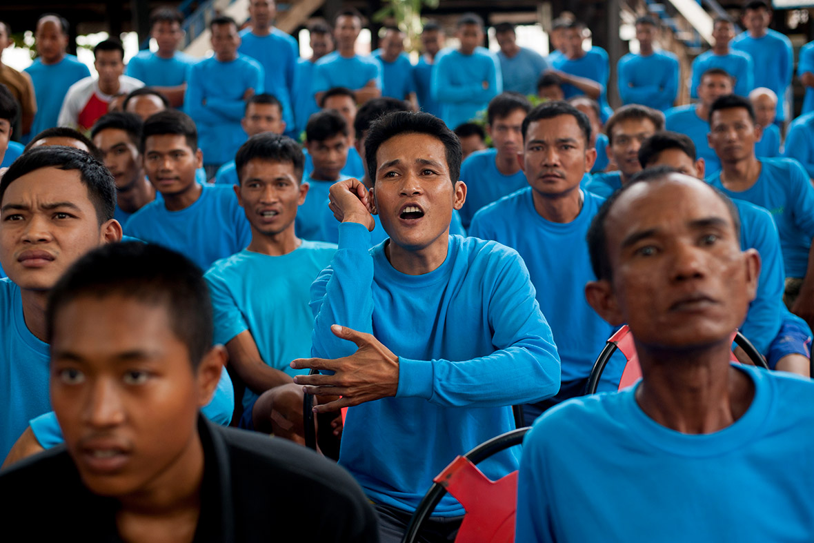 Inmates react during a Muay Thai fight at Klong Pai prison