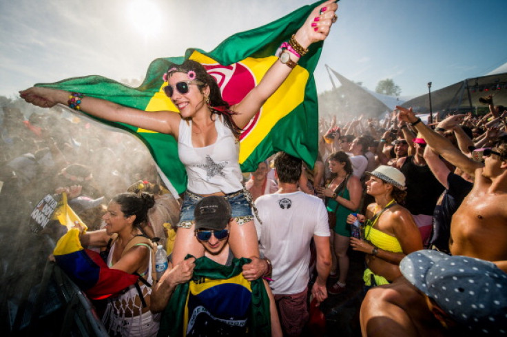 Revellers party during the first day of the Tomorrowland music festival, in Boom, on July 18, 2014.