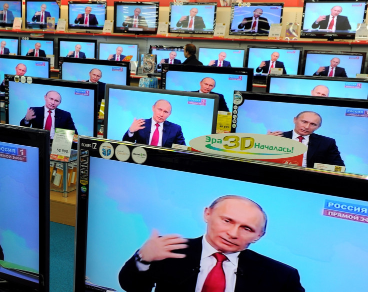 Russian president Vladimir Putin on television sets in a Moscow electronic goods store (Getty)