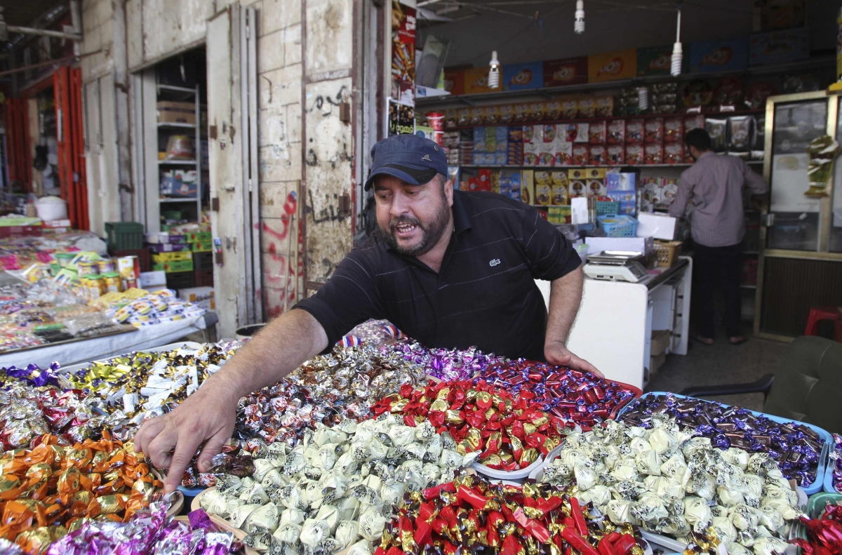 Palestinian vendor sells sweets