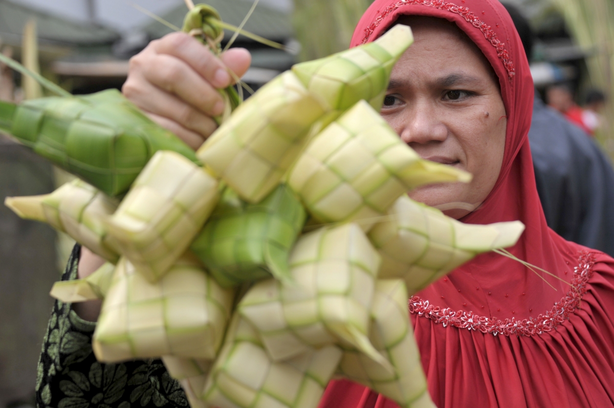 Muslim Woman Buys Rice Cakes